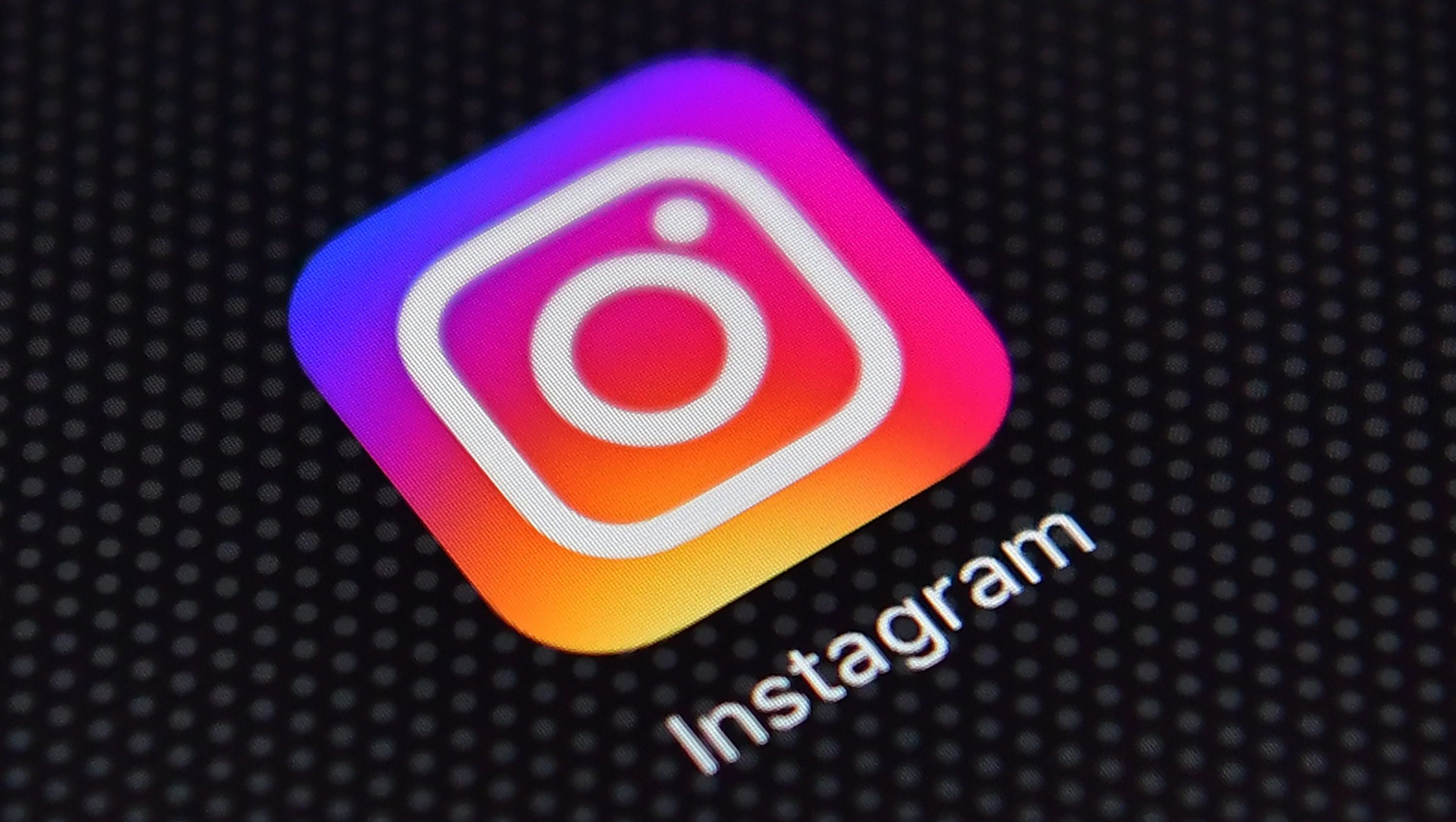 The Instagram app logo is shown on an iPhone. According to an AP-NORC Center for Public Affairs Research poll, a third of black teens use Instagram almost constantly, compared with 1 in 5 white teens.