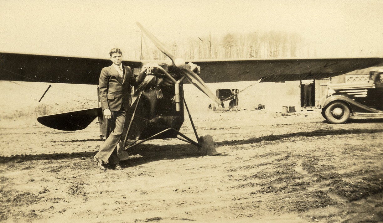 James H. Park stands next to an airplane at the Black Mountain Airport in 1939.