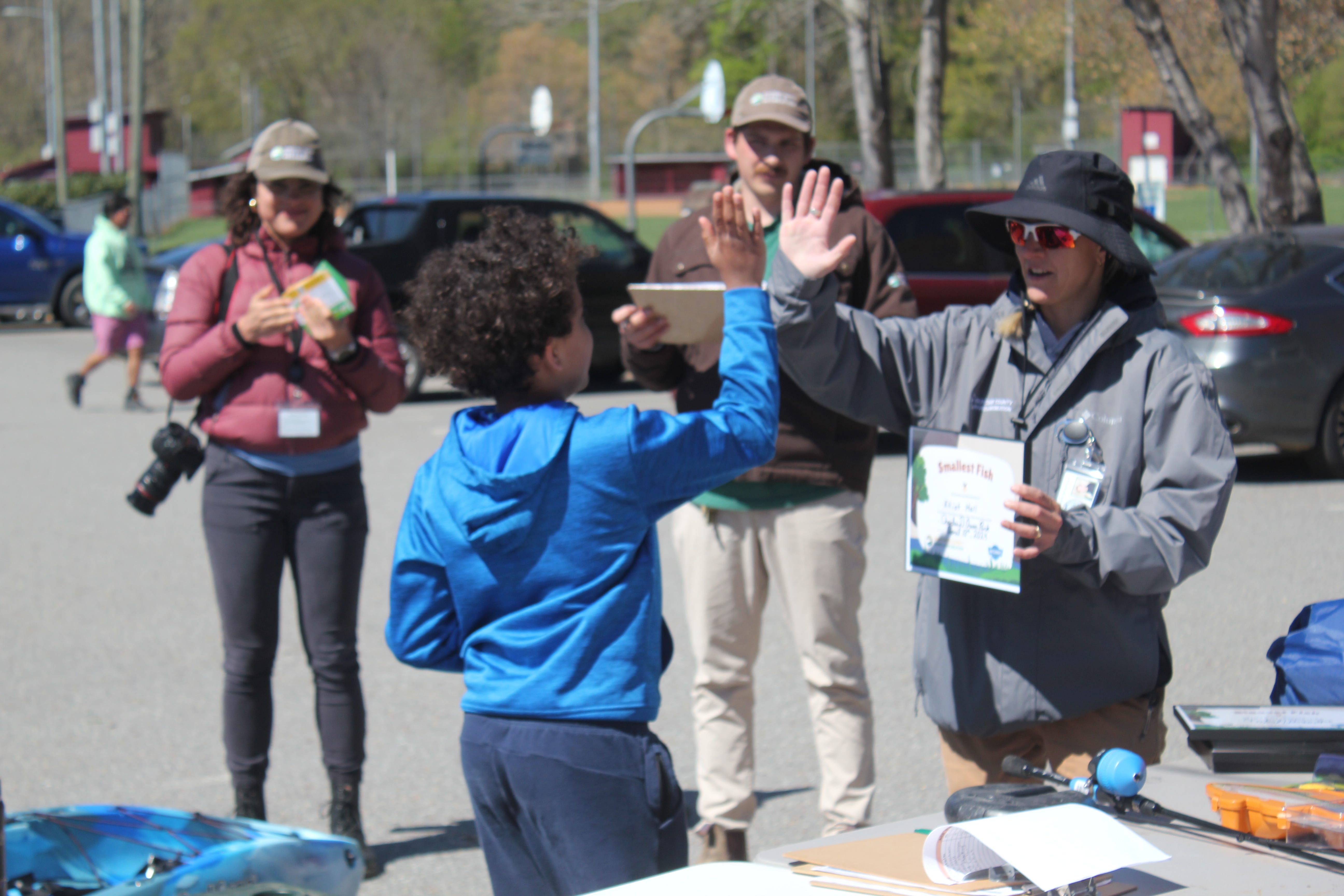 A child picks out a prize at Buncombe County Parks and Recreation's kids fishing tournament at Charles D. Owen Park April 13, 2024.