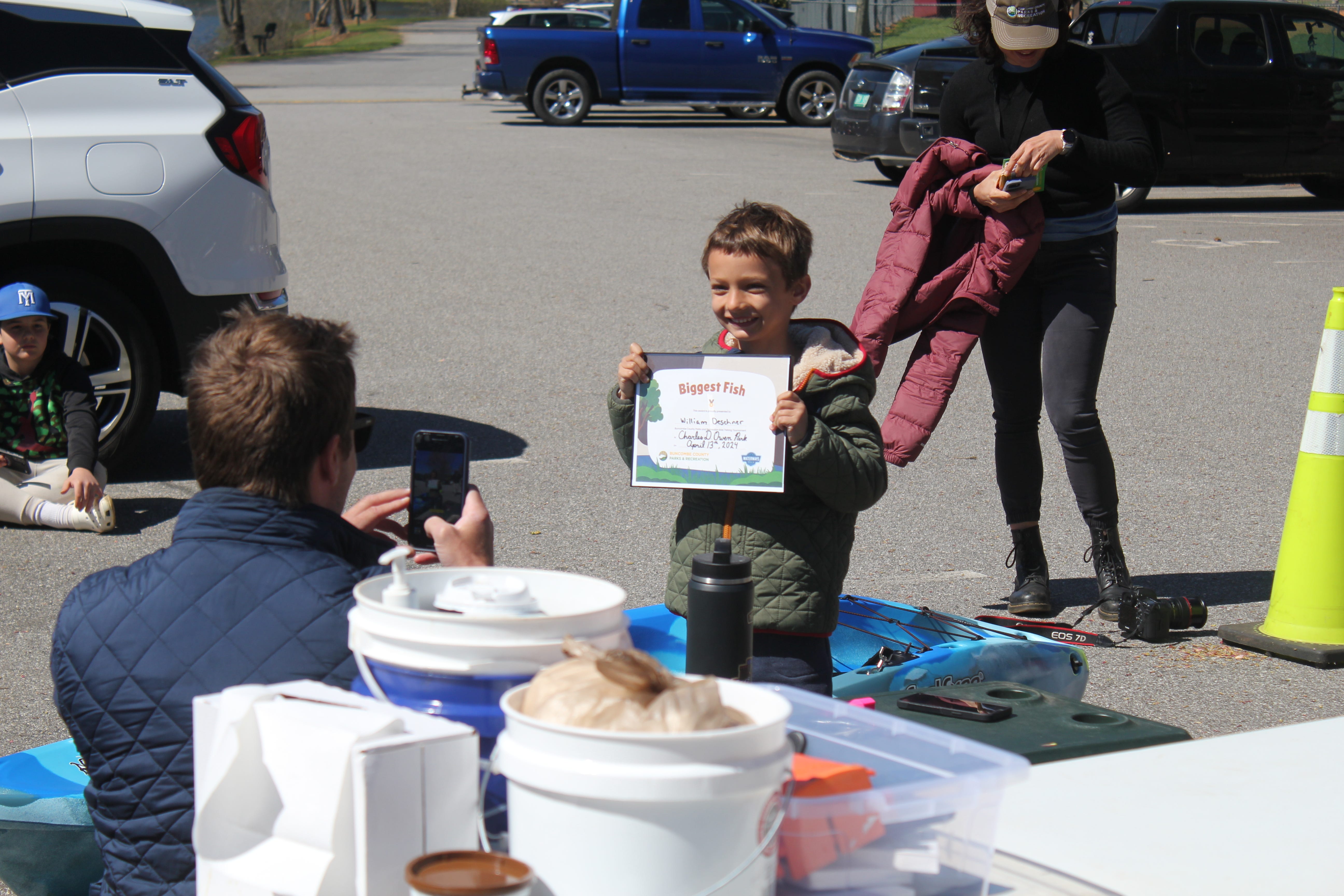 With a catch of a 13.5 inch bass, William Deschner won the grand prize of Buncombe County Parks and Recreation's kids fishing tournament at Charles D. Owen Park April 13, 2024.