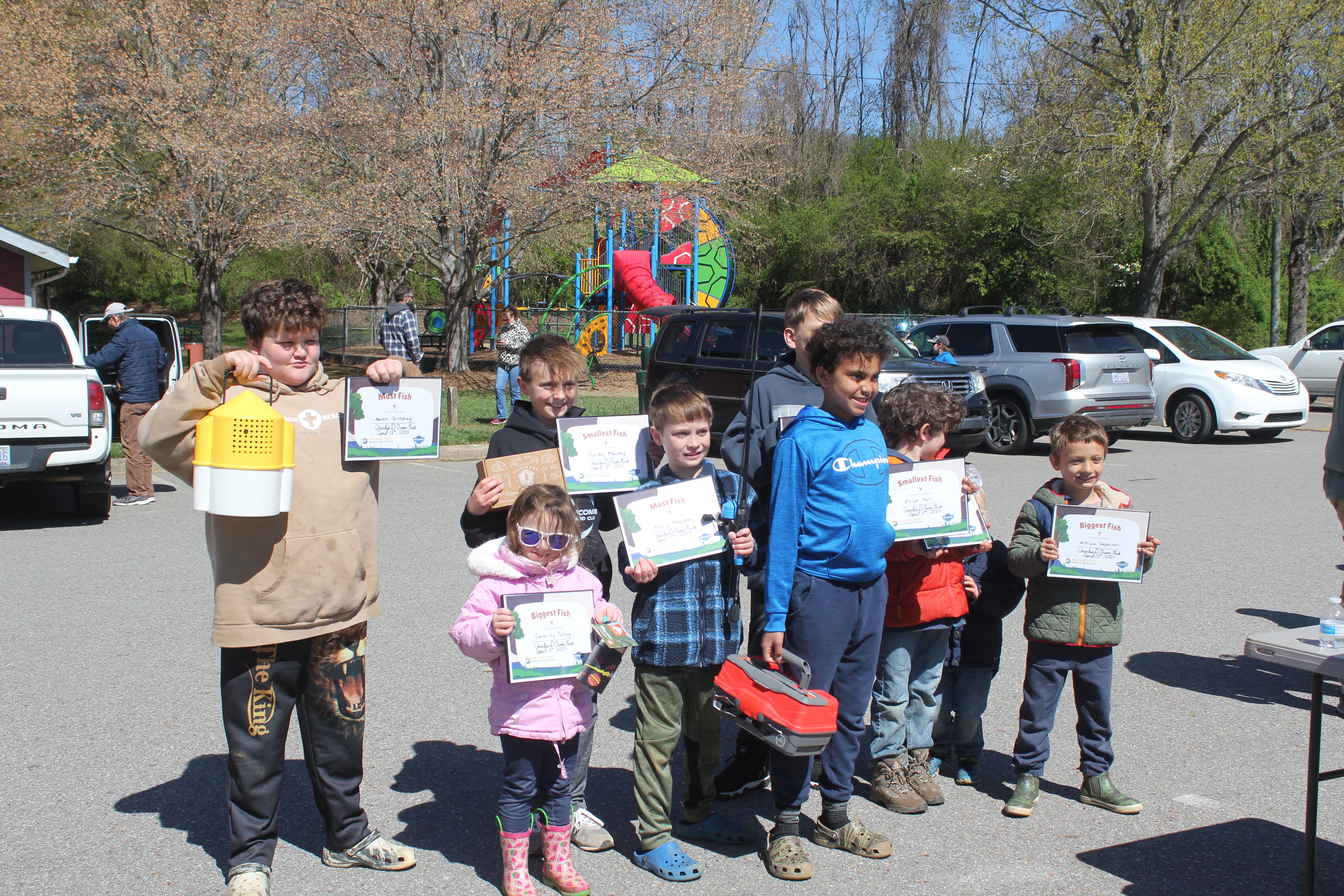 The winners of Buncombe County Parks and Recreation's kids fishing tournament at Charles D. Owen Park gather for a group photo April 13, 2024.